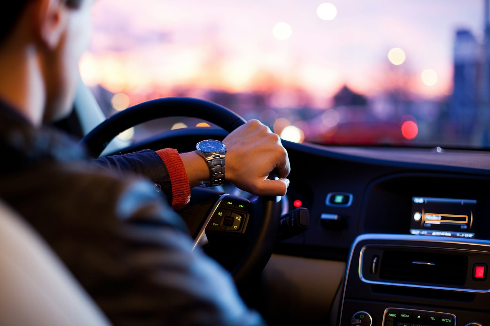 Chauffeur driving at dusk