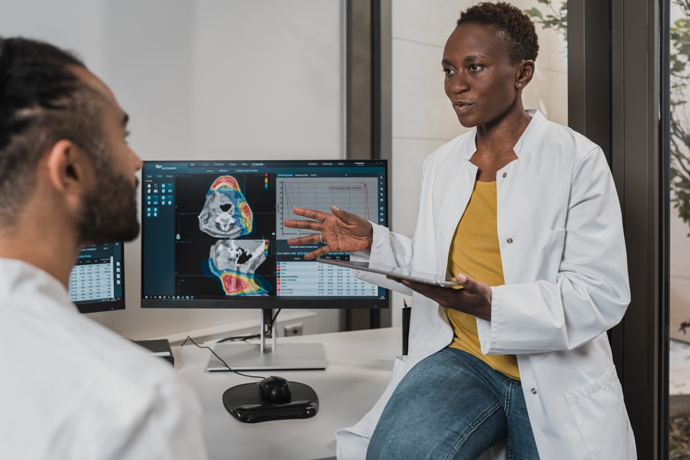 Physicians reviewing diagnostic scans